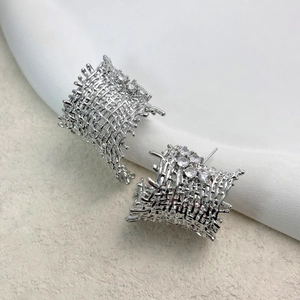 Silver woven mesh stud earrings with sparkling cubic zirconia in a modern hollow style