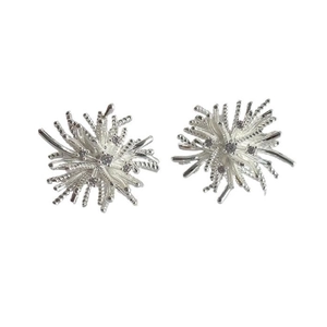Elegant silver snowflake firework stud earrings with sparkling zircons on white background