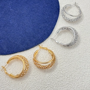 Boucles d'oreilles créoles doubles dorées et argentées ornées de zircons brillants