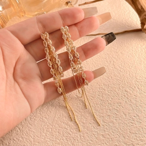 Golden wheat leaf tassel earrings with sparkling crystals and long chain fringe details