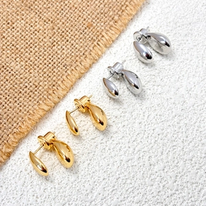 Minimalist gold and silver waterdrop earrings with a sleek two-tone streamlined design