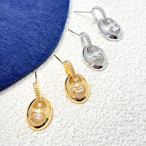 Gold and silver oval heart earrings with cubic zirconia and pig nose textured hooks