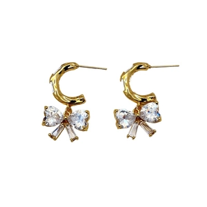 Elegant gold C-shaped hoop earrings with sparkling crystal bow pendants for women