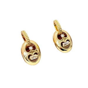 Gold oval pig-nose earrings with heart-shaped zirconia inlay and milgrain hook detailing