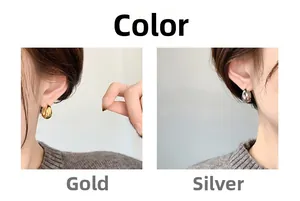 Minimalist thick geometric hoop earrings in gold and silver mirror finish on model