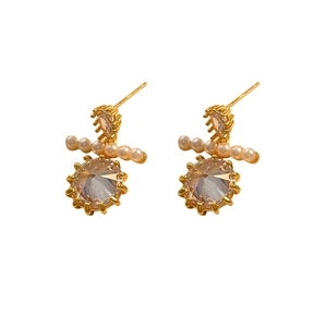 Elegant gold earrings featuring white pearls and round faceted cubic zirconia stones