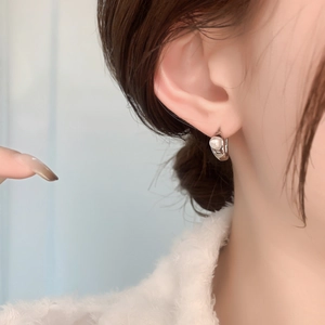 French style 18K gold plated irregular pearl huggie earrings on model for women