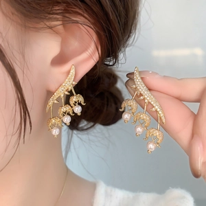 Elegant gold lily of the valley earrings with zircon paving and delicate pearl drops