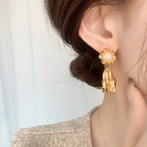Elegant gold leaf tassel earrings with white pearls and minimalist leaf drop design