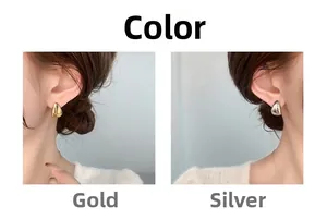 Detailed close-up of water drop stud earrings in gold and silver metallic finishes