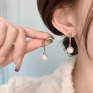 Elegant 18K gold plated pearl drop earrings for women with a minimalist romantic design