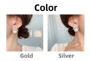 Detail showing elegant gold and silver earrings with white pearls and sparkling zircons