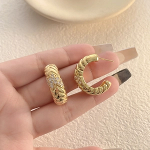 Chic 18k gold plated C-shaped hoop earrings with wavy texture and micro-set cubic zirconia