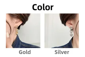 Detailed comparison of gold and silver triple heart drop earrings with inset crystals