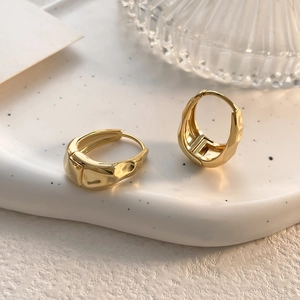 French style mirror finish irregular gold hoop earrings with a modern lava texture