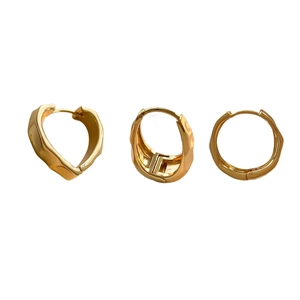 Three-piece gold hoop earrings set with irregular hammered texture in French minimalist style