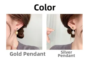 Detailed comparison of gold and silver bean stud earrings shown on model ear