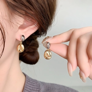 Chic two-tone gold and silver coffee bean stud earrings in polished 18K gold plated copper