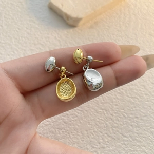Minimalist two-tone pebble stud earrings in polished 18K gold and silver plating