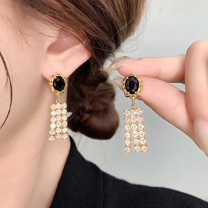 Vintage style gold earrings with black zircon oval stone and crystal fringe tassels