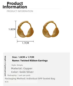 Detail view of gold twisted braid earrings with copper material and size specifications