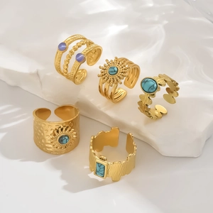 Vintage gold sunflower ring set with blue turquoise and purple beads on stone stand