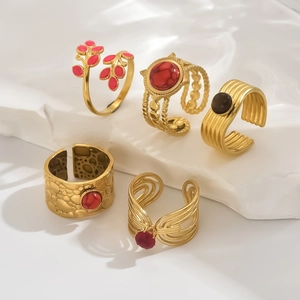 Retro 18K gold plated stainless steel ring set with zircon inlay on white marble