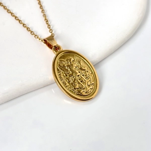 18k gold plated oval St. Michael relief pendant necklace on white marble base