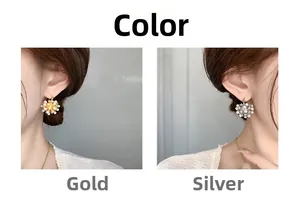 Side-by-side view showing the gold and silver snowflake pearl earrings on a model