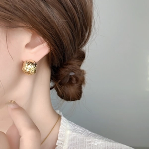 Elegant woven sphere gold stud earrings for women with intricate texture and metallic finish