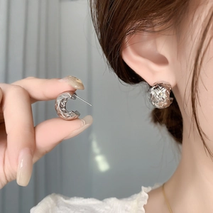 Silver woven texture C-shaped stud earrings for women with a vintage metallic finish