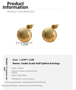 Detail view of 1.3cm gold plated snake skin textured ball stud earrings for women