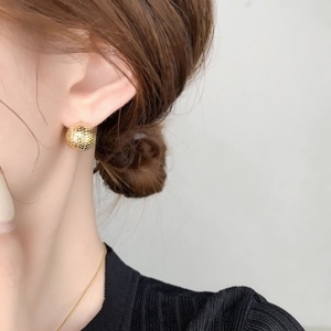 18k gold plated mesh sphere stud earrings with snake scale texture on model