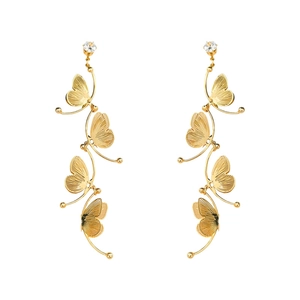 Golden butterfly tassel earrings with sparkling zircon studs on a white background
