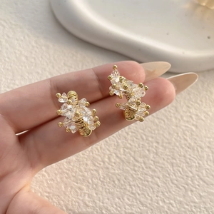 U-shaped horseshoe stud earrings with full crystals in a gold-wrapped handmade design