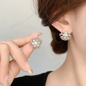 Sparkling zircon snowflake stud earrings in silver finish for women with minimalist style