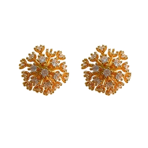 Golden snowflake stud earrings with sparkling zircon crystals in a radial flower design