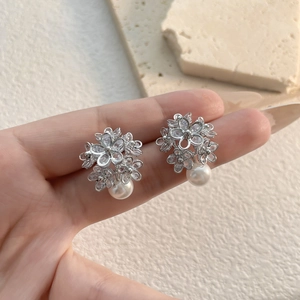 Sparkling micro-pave zircon flower earrings with white pearls and silver metal finish