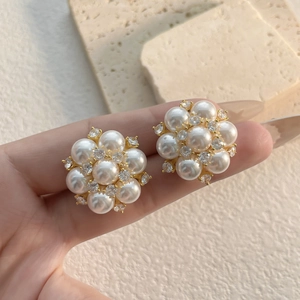 Exquisite pearl flower stud earrings with sparkling cubic zirconia on gold metal base