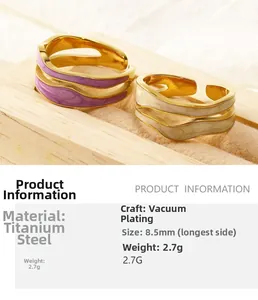 Detail view of wavy titanium steel rings with lavender and ivory enamel inlays