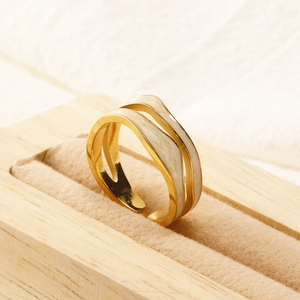 French style double-layer gold wavy steel ring with white drip oil in a jewelry box