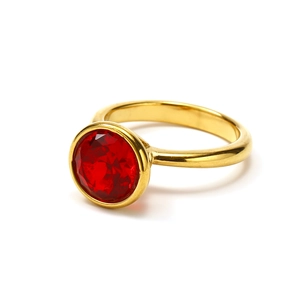 Polished 18k gold plated titanium ring with a large red round-cut zircon stone centerpiece