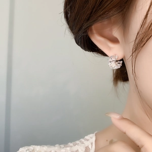 Elegant C-shaped silver stud earrings with sparkling cubic zirconia crystals and 18K plating