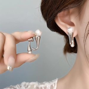 Minimalist silver-tone pearl earrings featuring sleek curved design for women