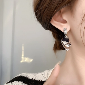 Elegant multi-layer shell earrings in silver with shimmering cubic zirconia accents