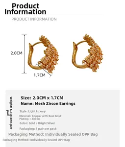 Detail of vintage gold-plated mesh earrings with zircon inlay showing size specifications