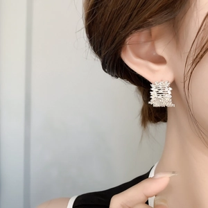 French vintage silver plated pavé diamond rectangle earrings worn by a female model