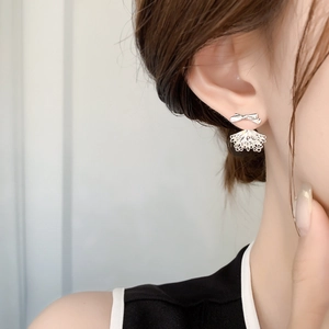 Silver bow stud earrings with hollow lace fan-shaped pendants for a graceful look