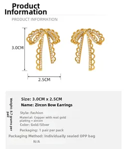 Detailed view of lace bow earrings with cubic zirconia, sized 3.0cm by 2.5cm