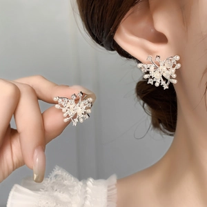 Sparkling butterfly earrings with zircons and pearls on silver-plated metal base
